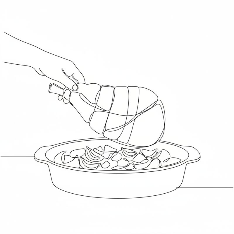 En hånd senker en bundet lammebog ned på en bunn av løkbåter i et ovalt ildfast fat